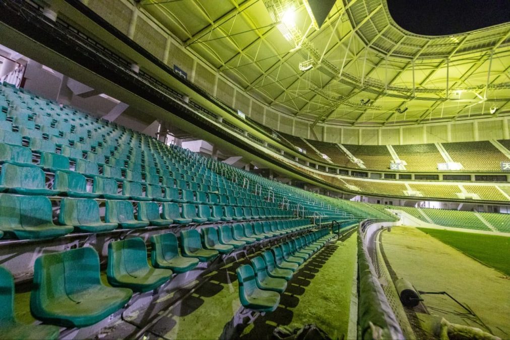 Unfoldable plastic bucket seats on the lower terraces of Talanta stadium.