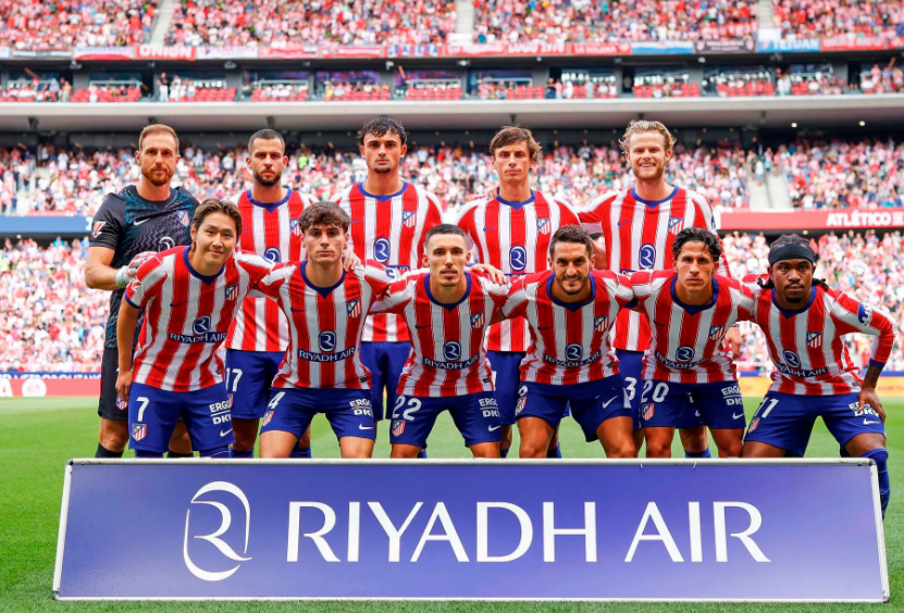 Atletico Madrid players pose for a team photo ahead of their La Liga clash, with Julian Alvarez absent from the squad.