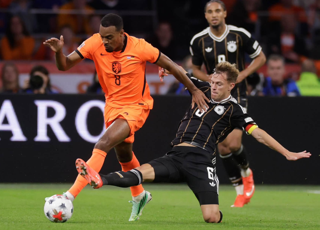 Klopp returns to the touchline but Xavi holds his Germany to a draw in their debut