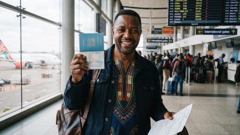 A man holding his Kenyan passport.