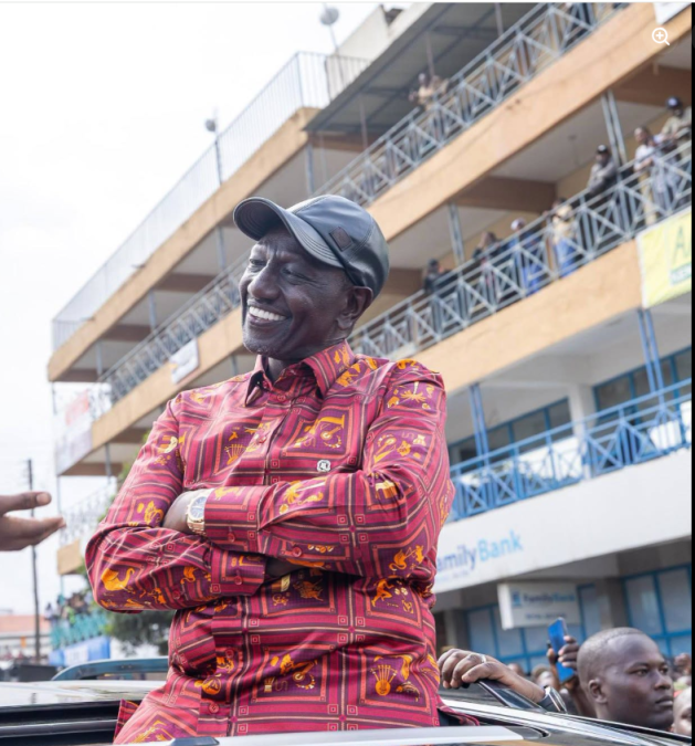 William Ruto listening to the young girl's poem in Bomet County. PHOTO/https://www.facebook.com/williamsamoei