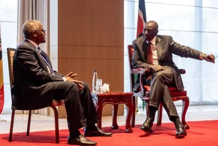 President William Ruto chats with billionaire Aliko Dangote. PHOTO/@WilliamsRuto/X